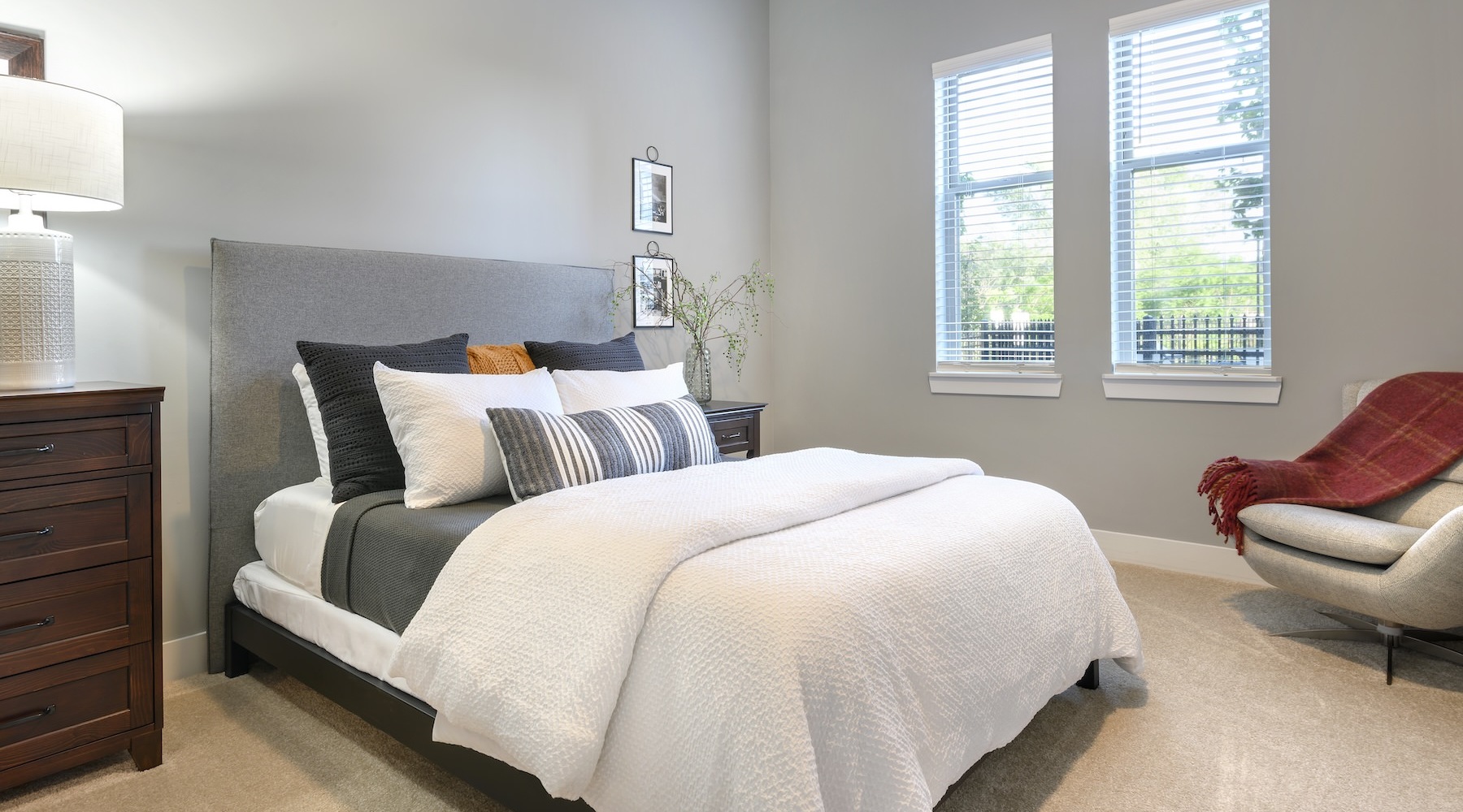 bedroom with a large window and a bed